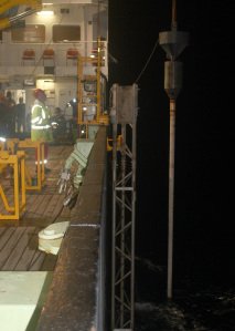 Night-time recovery of the 12m long piston coring rig.